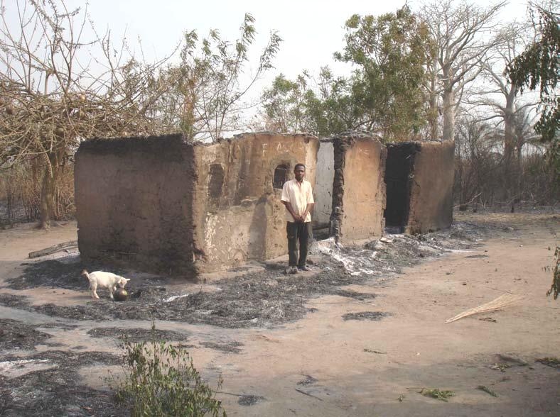 Klokpoé, where a total of 64 homes caught fire and over 200 people were displaced. The next photo shows a man in Wodomé standing in front of his destroyed house.