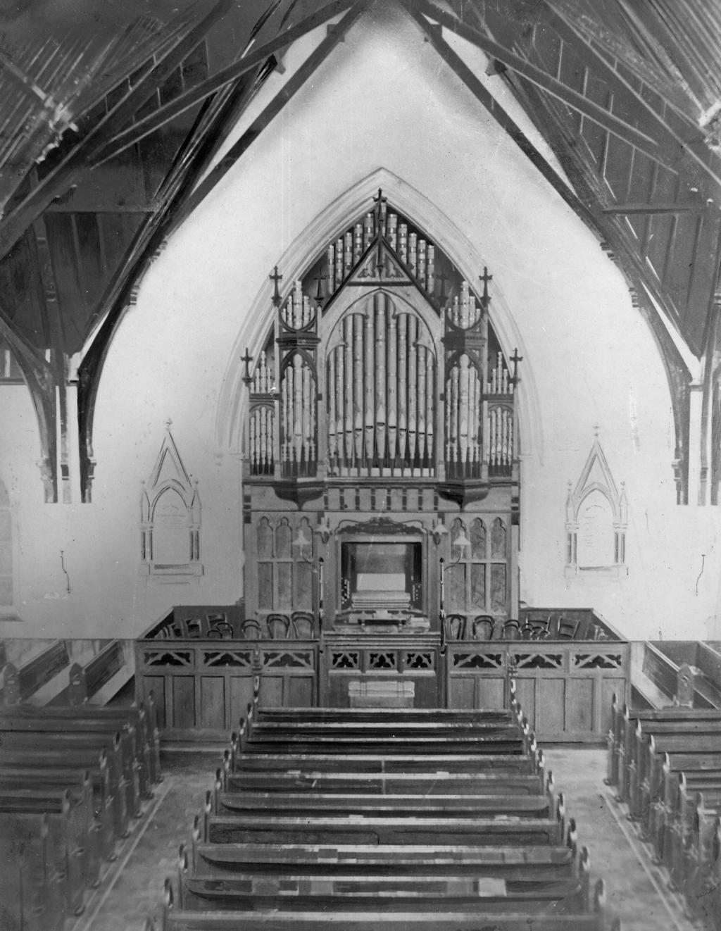 This early photograph of the sanctuary may date from pre-1907 as the lighting appears to be by oil lamps.