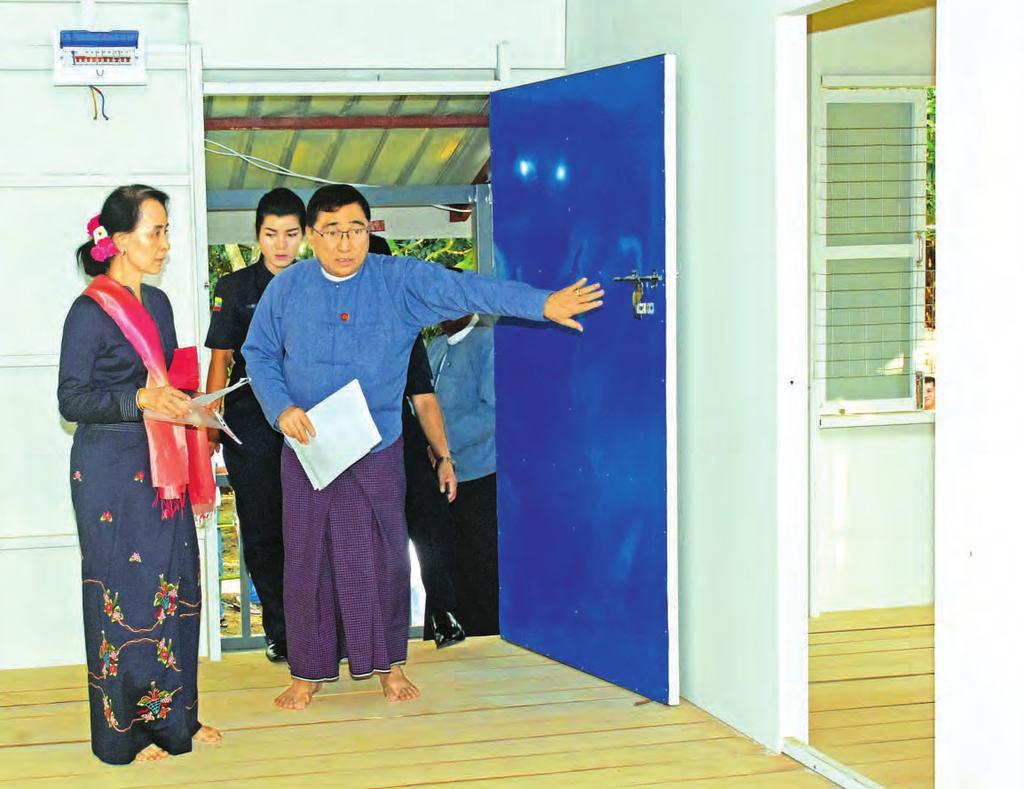 com Wednesday, 20 December 2017 Myanmar, Bangladesh agree on terms of repatriation State Counsellor Daw Aung San Suu Kyi, left, inspects the model rural house which will be built and donated by the