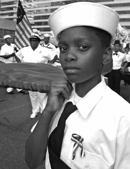Suggestions for the Teacher Derrick Wallace, 12, a member of the U.S. Navy League Cadet Corps, proudly carries the flag in a parade in Philadelphia, Pennsylvania Credit AP/WWP H Rumph, Jr c.
