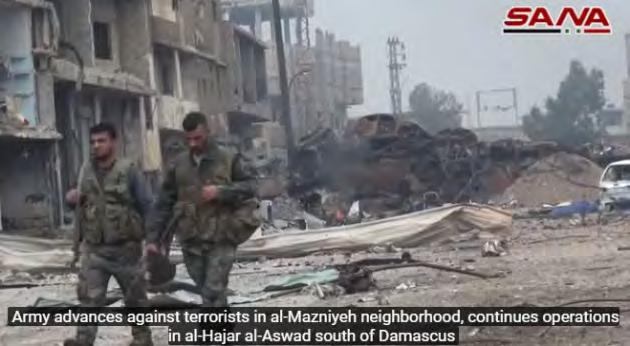 Left: Syrian army soldiers in the Al-Madhaniya neighborhood.