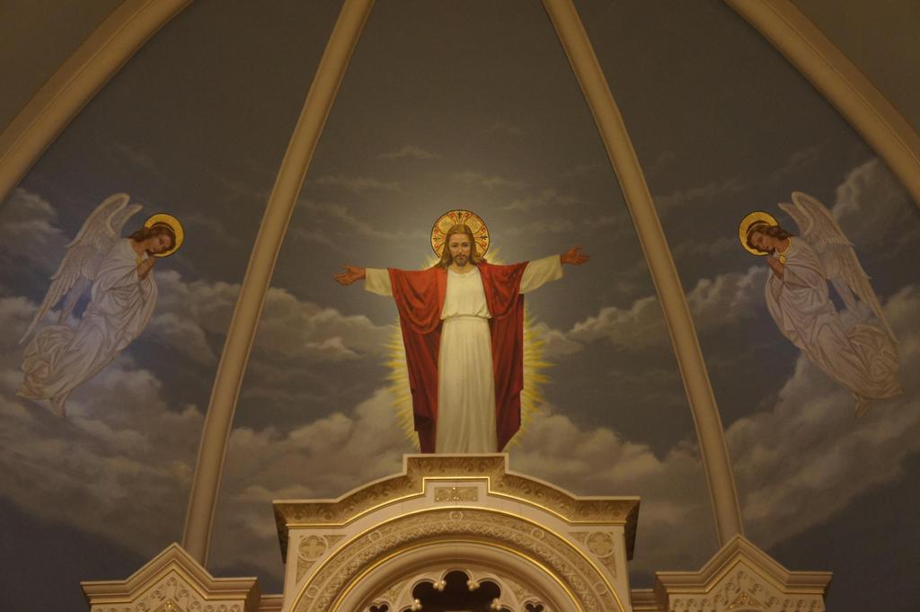 A figure of Christ, his arms outstretched, stands in the firmament, his gaze is toward earth and his people. He prepares to descend to earth stepping from cloud to cloud.