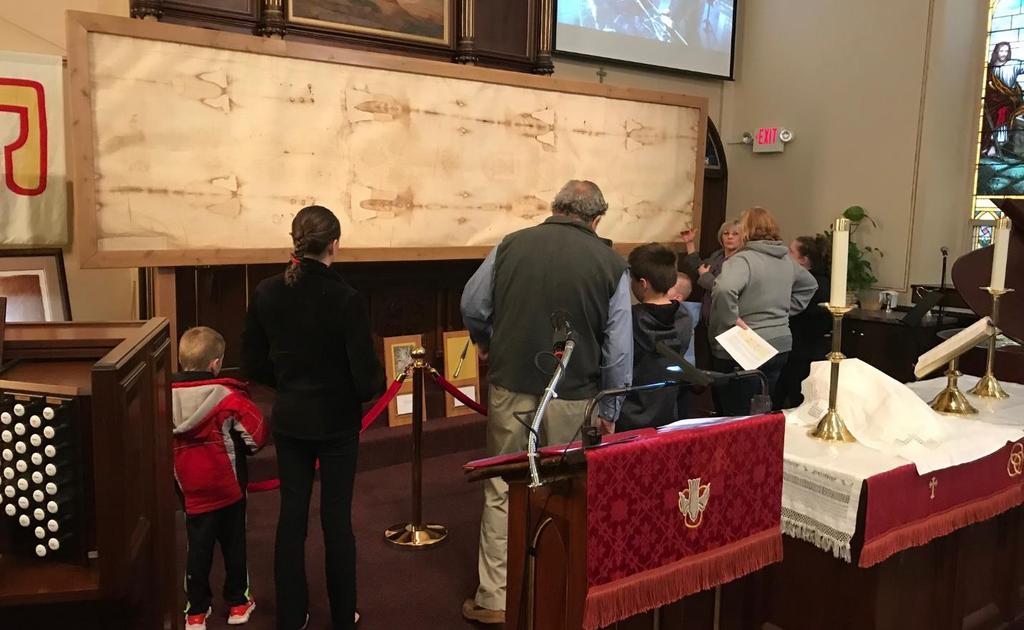 Visitors and members inspecting our copy of the Shroud of Turin OUR VISION STATEMENT St.