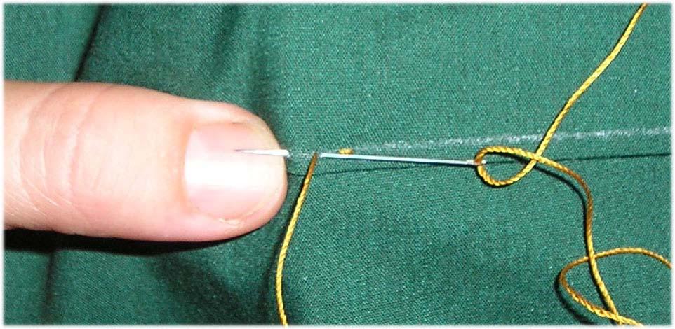 When you reach the end of the thread or the section you are sewing, make a knot on the wrong side of the fabric.