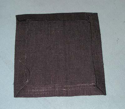 fabric over each other, a bigger one on the bottom (light gray in Fig.
