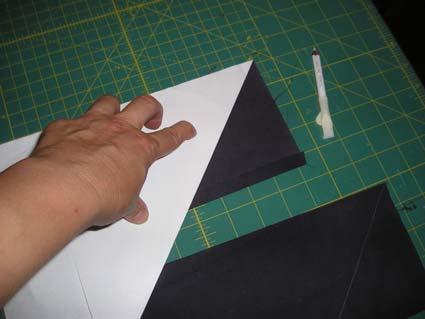 4. Put the piece of paper on top of each fabric piece,