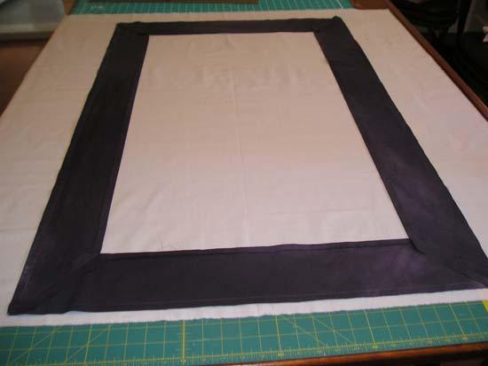 13. Put the white piece of fabric flat on the table, with the right side facing up (if it has a right