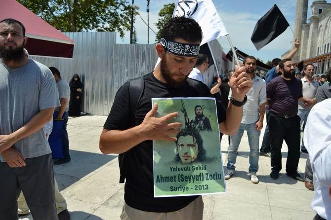 Man carries picture of Ahmet Zorlu at march at Fatih Mosque, 07 July 2013, Source: HaksozHaber North Caucasus Caucus is