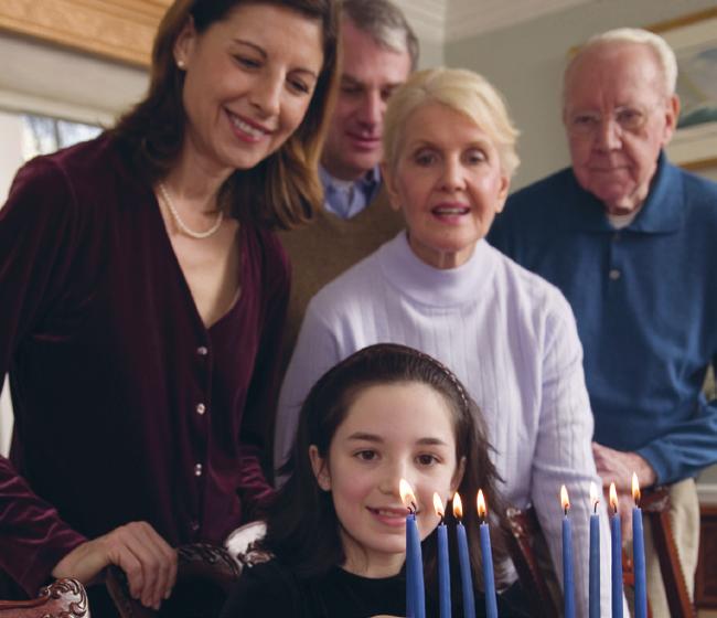 9 A4 Family Life Look at the photograph. It shows a Jewish family. A4 (a) Explain the importance of the family in Judaism.