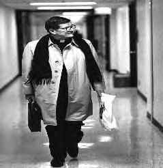 PHOTOS BY STEVE DONISCH Father O Callaghan walks the halls of