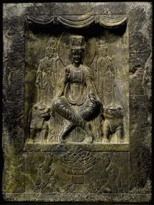 The two narrow sides are carved with a small figure of the Buddha inside a niche, with an abraded inscription on one side.