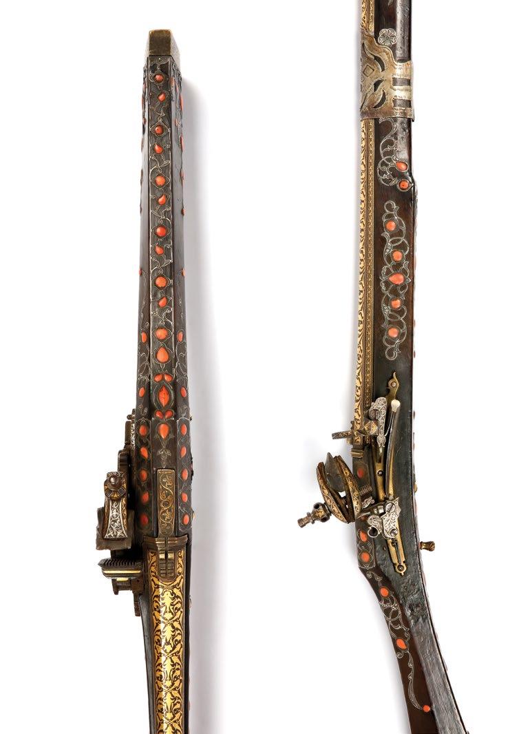 scrolling floral motifs secured to the length of the rifle.