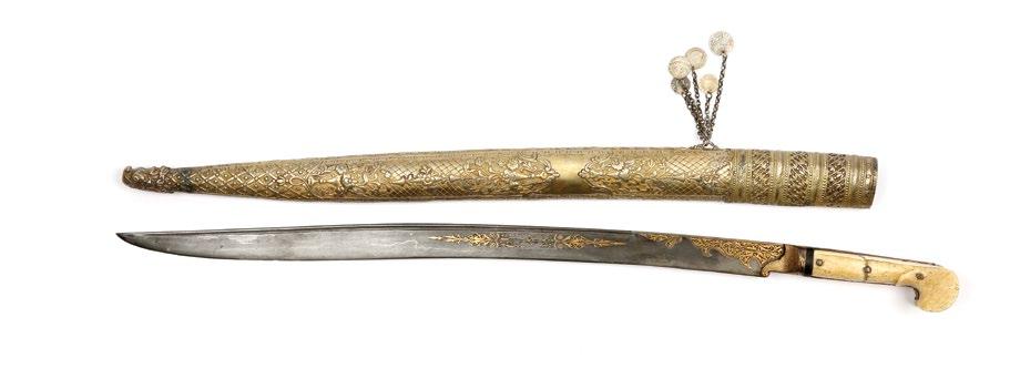Damask watered-steel patterned blade with seven different length grooves. Hilt with ivory grip scales and shim comprising gold gilt band decorations. In its skin scabbard.