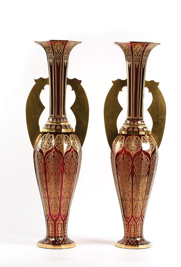 187. A pair of Red Bohemian Alhambra Vases مزهريتان من الكريستال البوهيمي األحمر colourless glass, casing in copper over ruby coloured,