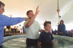 Dustin Hall, Cornerstone church pastor, baptizes James Wiggins.