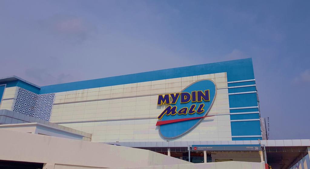 Mydin Holding Berhad acts both as a supplier of tailoring materials and a buyer of finished goods (baju kurung).
