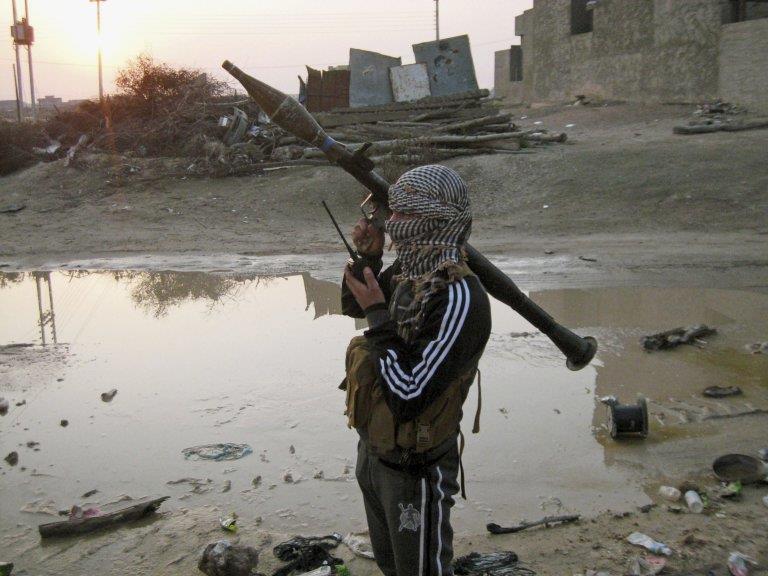 An Islamic State militant on patrol in the city of Fallujah in Iraq's Anbar province on 21 January, shortly after the city was seized by the group along with local Sunni insurgents and