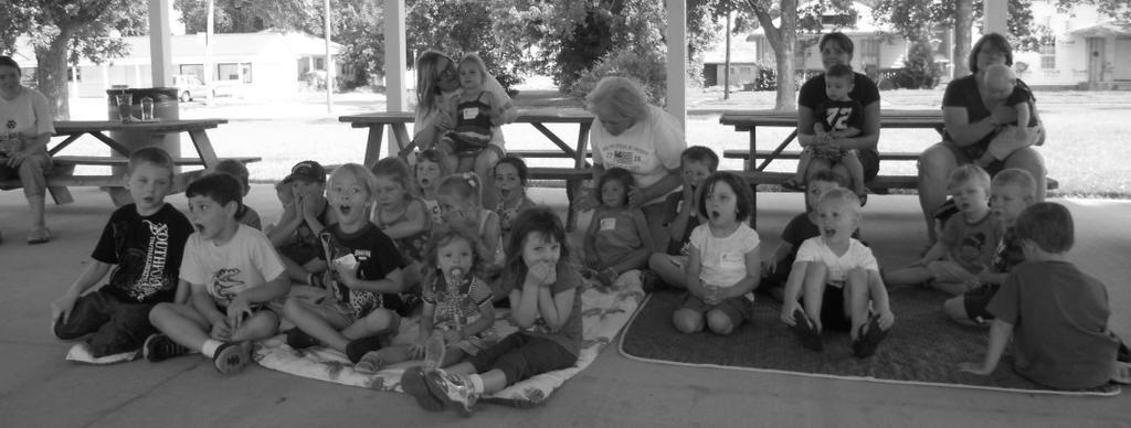 The Compass Page 7 Fun at Children s Story Time Good story-telling, good weather and a good turn-out added up to a successful children s story time this year!