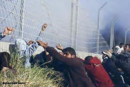 Right: Palestinian demonstrators near the border security