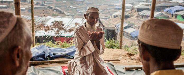 Summary 23 Imam Nurul, 53, during afternoon prayers at a makeshift mosque in Kutupalong refugee camp, Cox's Bazar District, Bangladesh.