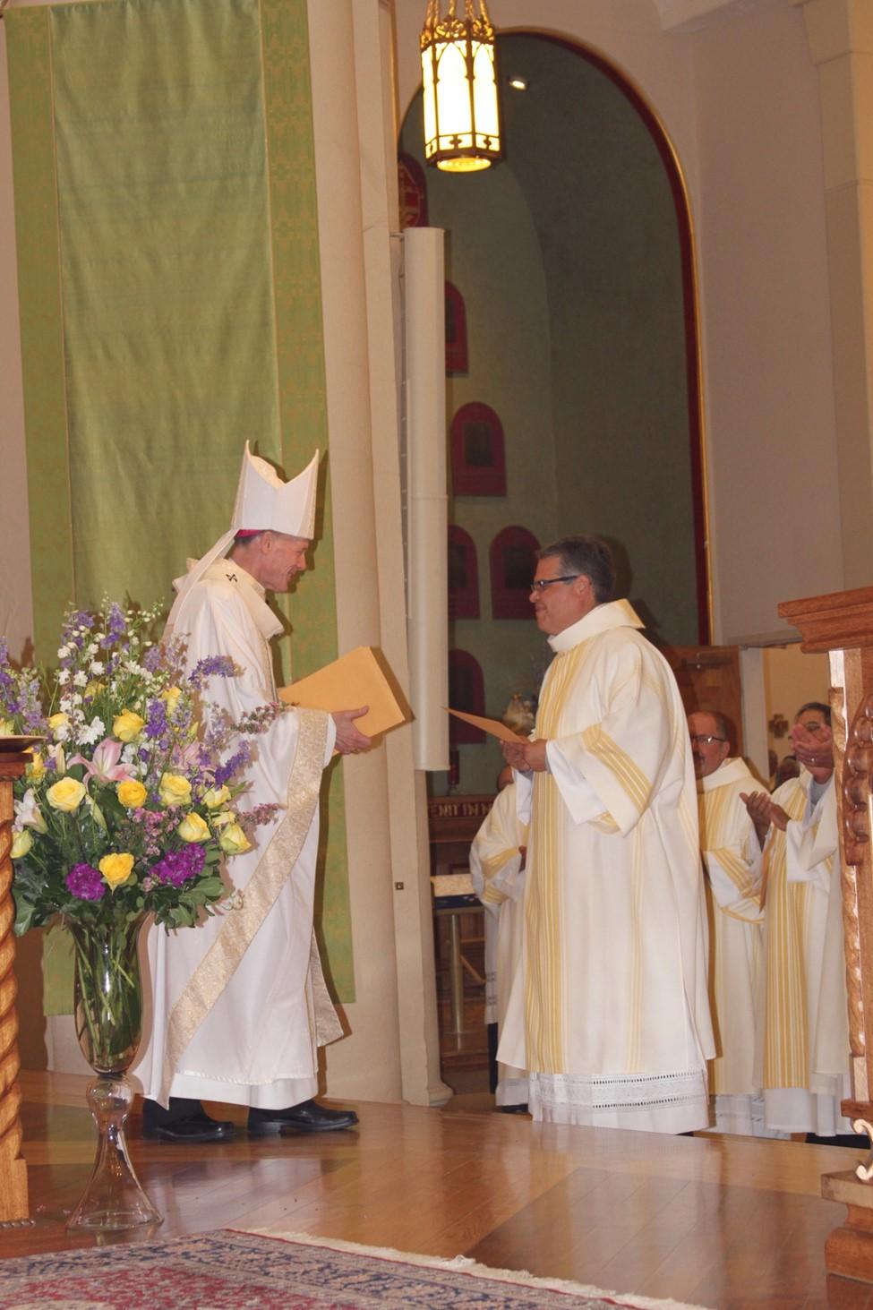 El Diácono; A Newsletter for the Deacons of the Archdiocese of Santa Fe Page 5 The Archbishop places the Book