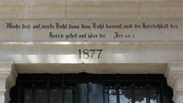 Biblical verse on the lintel of a former Templer house in the German Colony, Pales ne, which reads,"arise, shine, for your light has come, and the glory of the Lord rises upon you. Isaiah 60:1.