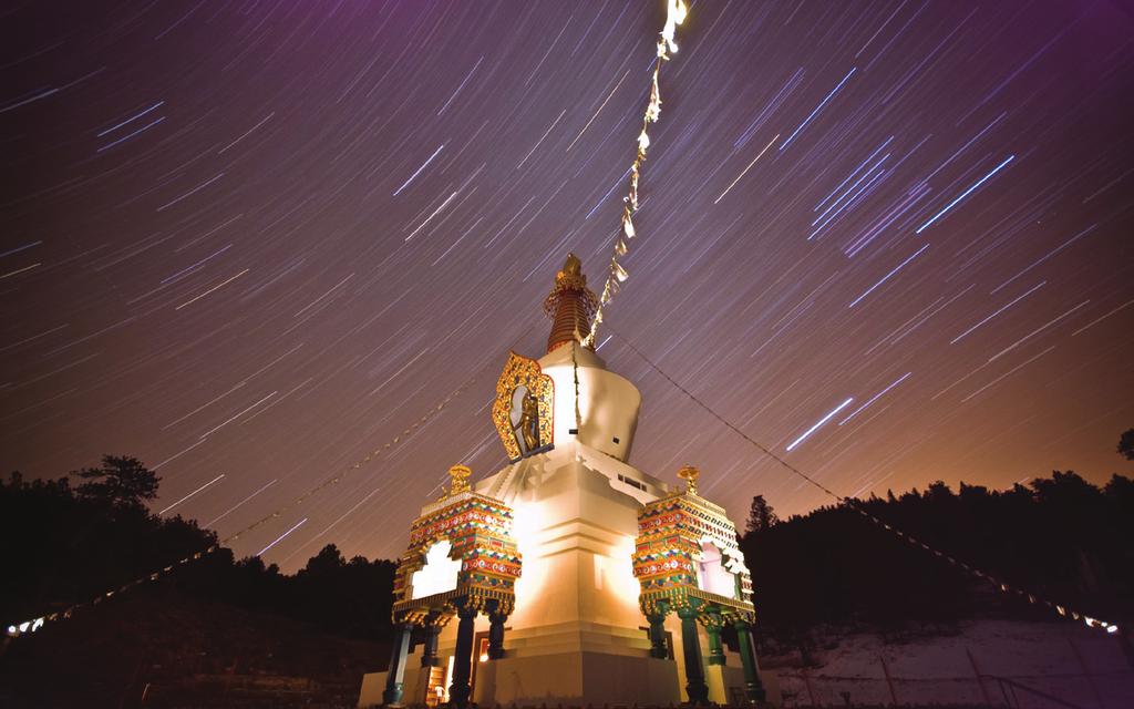 THE GREAT STUPA OF DHARMAKAYA Which Liberates Upon Seeing Rising among wooded hillsides, the Great Stupa of Dharmakaya crowns a meadow at the upper end of Shambhala Mountain Center s main valley and