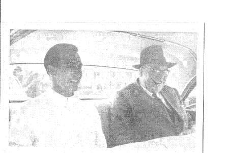 H.H. The Aga Khan in a car in Arusha, Tanganyika, in