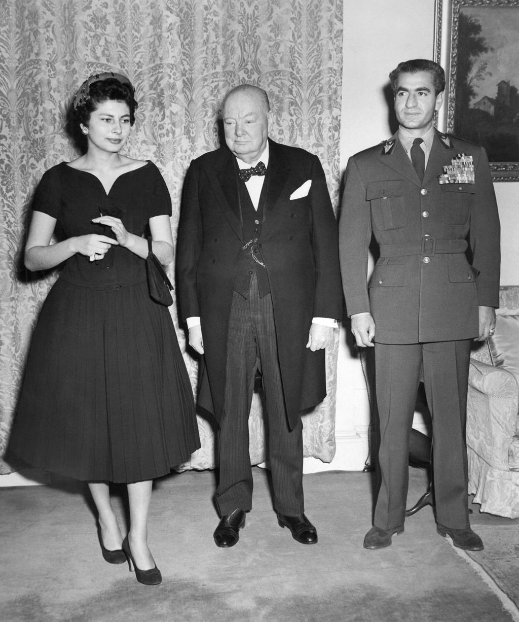 British Prime Minister Sir Winston Churchill poses with the Shah and Queen Soraya of Persia on February 21 at his official London residence, 10