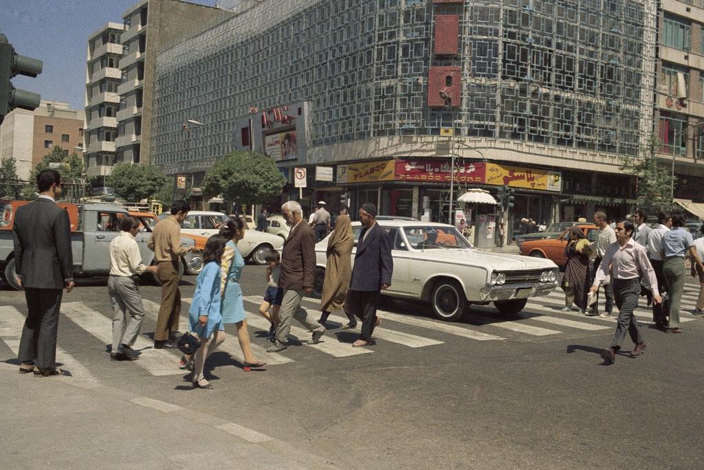 A street scene showing pedestrians on a sidewalk, June 16, 1970, Tehran, Iran.