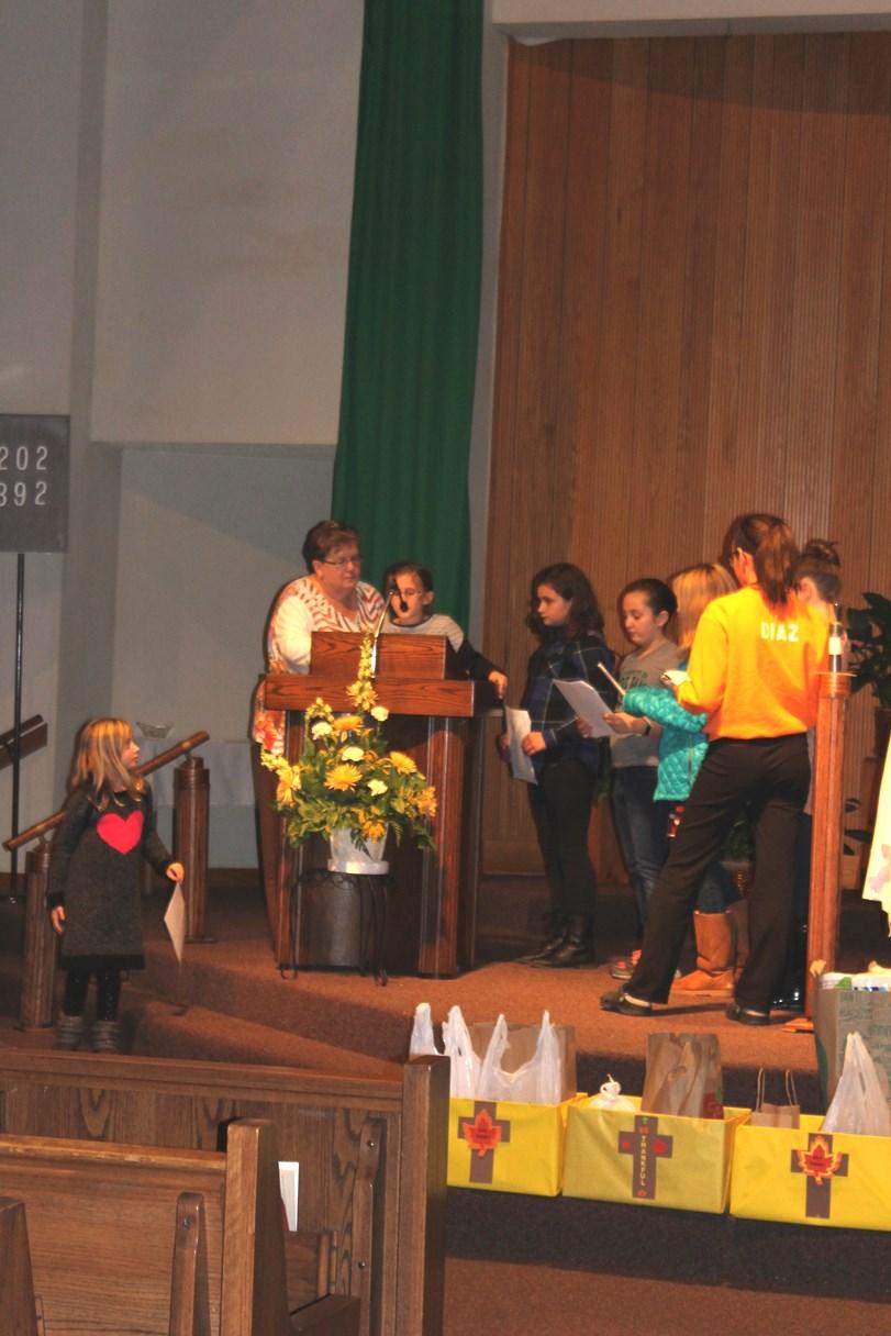 Our Faith Formation Sunday Youth Mass Liturgical Servers Back Row: Left to Right: Julianna Zandzian, Carter Smith,