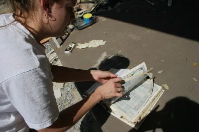 Navy Point resident displays a bible that washed into her