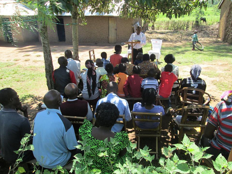 Here s Pastor Erustus in Kenya under some shade trees at an old couple s house that used to walk 4 miles one way to church.