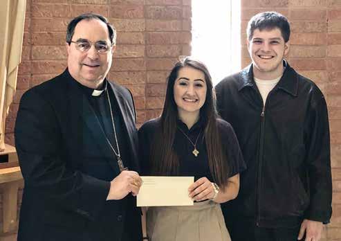 Diocesan Pro-Life Oratory Contest Winners Announced by Anthony Fabio Bishop Michael Duca gives 1st place winner, Celeste Lirette, her prize money.