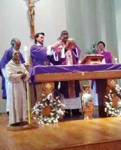 Rothell Price as the guest speaker. Pictured: Deacon Marc Vereen assists Fr. Price at Mass in Bastrop.