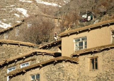 Afghanistan Housing The most common dwelling is a mud-brick structure consisting of several rooms and surrounded by high mud walls designed to provide security from enemies, seclusion for women, and