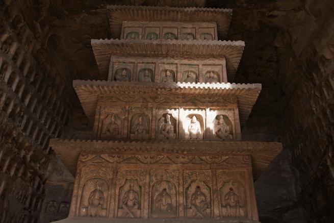 Instead of images, the center of many of the Yungang caves was occupied by a single square tower, cut from the cliff to form a
