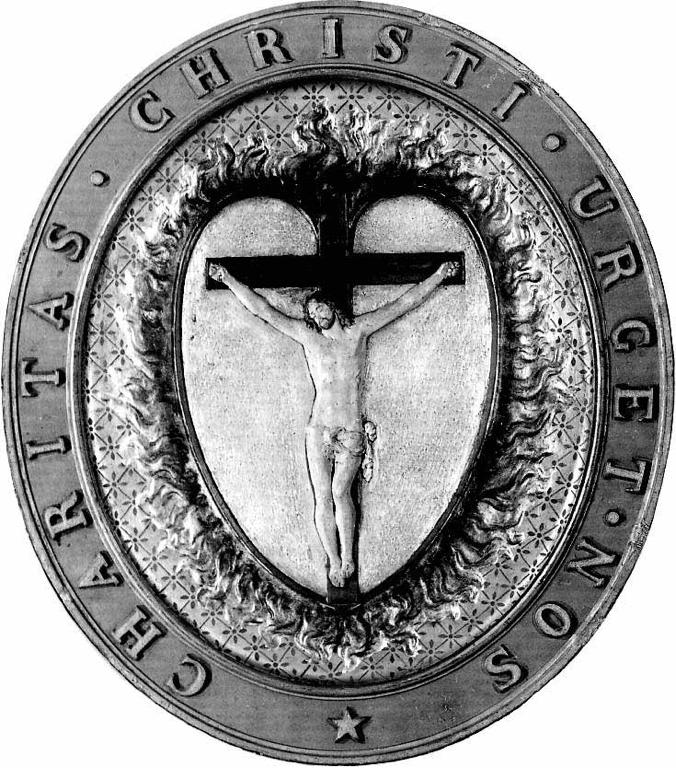In the Daughters emblem, seen here, a burning heart is surmounted by the crucified Lord, and surrounded by Charitas christi urget