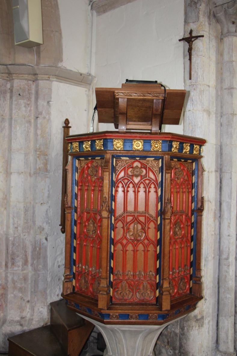 The beautifully carved and painted pulpit at