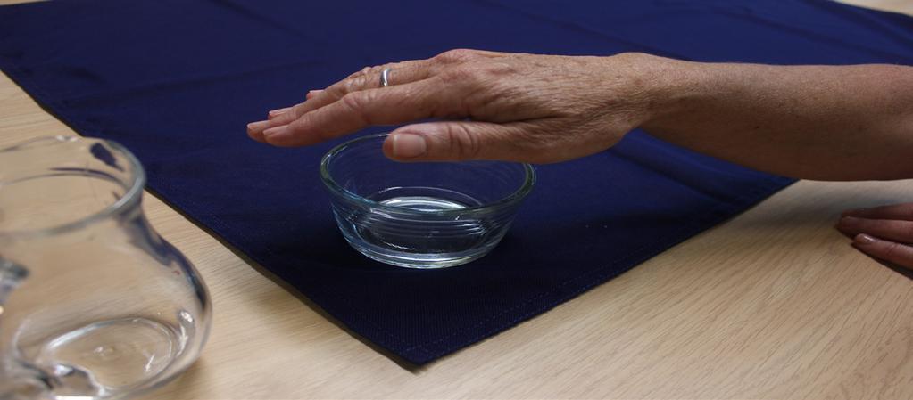 MOVEMENTS WORDS As the water settles, gently lower your hand over the bowl in a gesture of blessing. Touch the blue cloth.