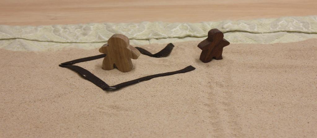 MOVEMENTS WORDS Build a shelter* next to the two figures using the brown felt by placing the four strips into a square, and bending one of the edges back to make a little door.