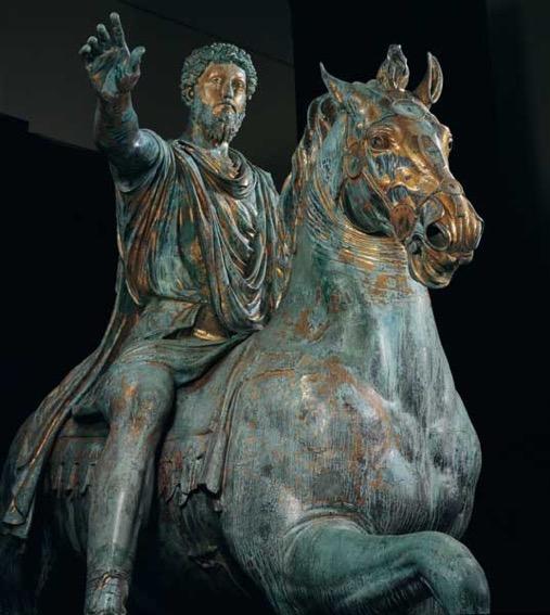 Equestrian Statue of Marcus Aurelius, ca. 175 the emperor possesses superhuman grandeur for two reasons..what are they?