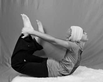 Come into Frog Pose with the fingertips on the ground in between the knees (11a).