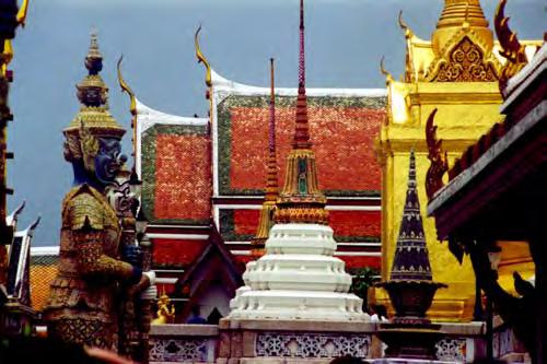 The glittering grounds of Wat Phra Kaew, adjacent to Wat Pho, are among the most striking destinations in Thailand. Note the nagas or eagles on each roof, and the yakshas standing guard.