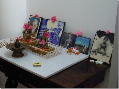 Pictures of Sri Ramana line the altar.