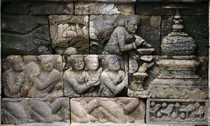 Two kinnara or heavenly bird-humans complete the scene which seems to be framed by an architectural element such as a doorway.