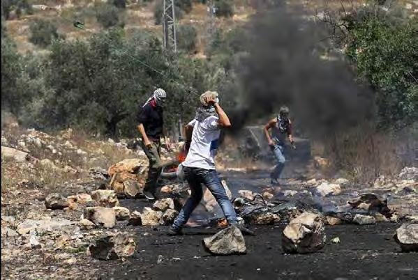 4 Palestinians throw rocks at Israeli security forces in the village of Qadoum during the weekly riot (Palinfo Twitter account, June 9, 2017).