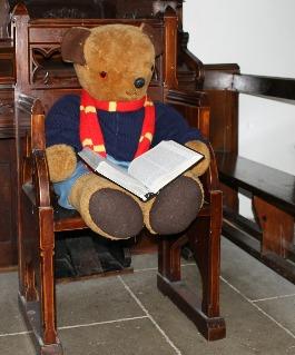 4. Bible The Pilgrims Trail Teddy Horsley walks up to the front of the church.