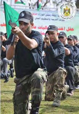 Gazan youth put on a military display at the graduation ceremony of a winter camp