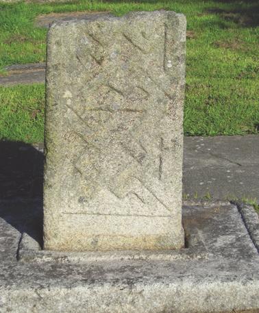 Cross with a distinctive fret pattern decoration is reputed to mark the grave of